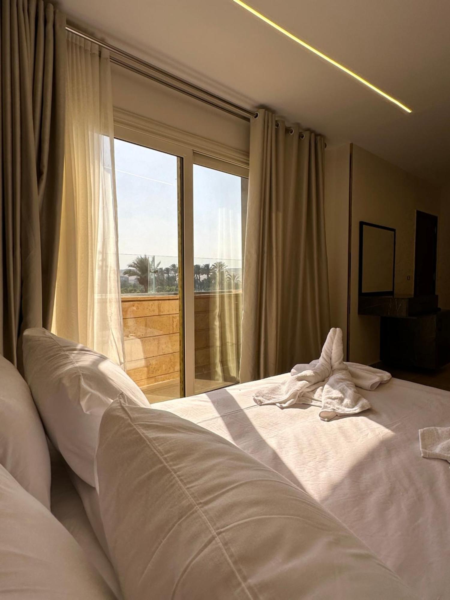 Taj Pyramids View Inn Kafret el-Gabal Екстериор снимка