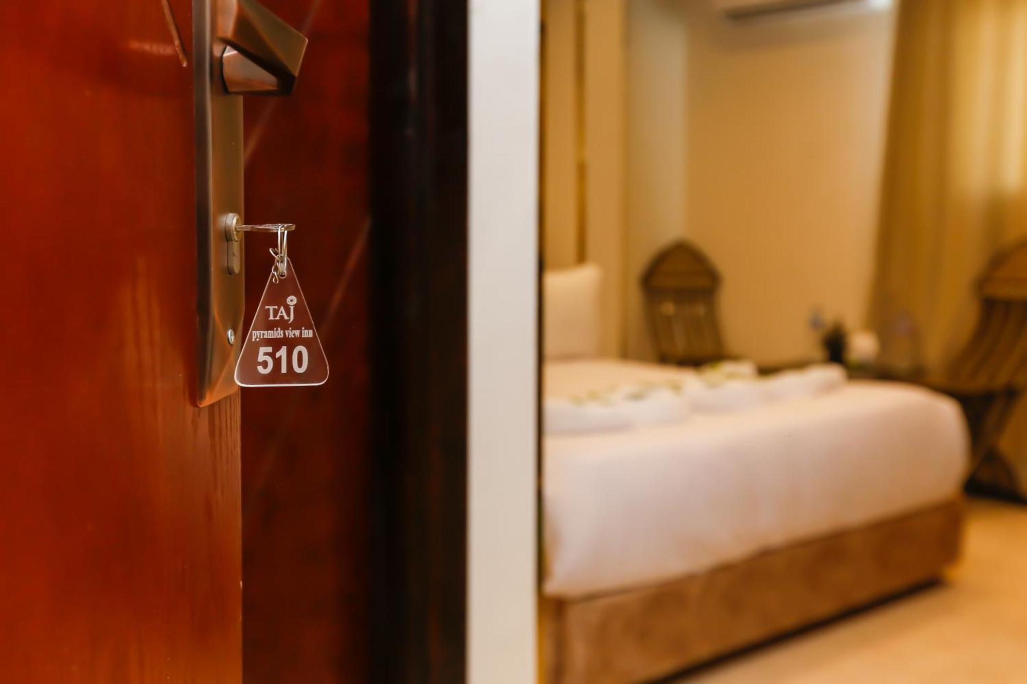 Taj Pyramids View Inn Kafret el-Gabal Екстериор снимка